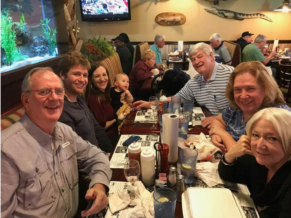 Hildebrand - Family Get-Together for Hannahs 1st trip to Orange Park, Florida.  Location - Whiteys Fish Camp & Seafood Restaurant on February 2nd 2019.  Left to Right: Al Benson (Lauras Great Uncle) Justin Hildebrand (Hannahs Dad), Laura (Mom, holding Han